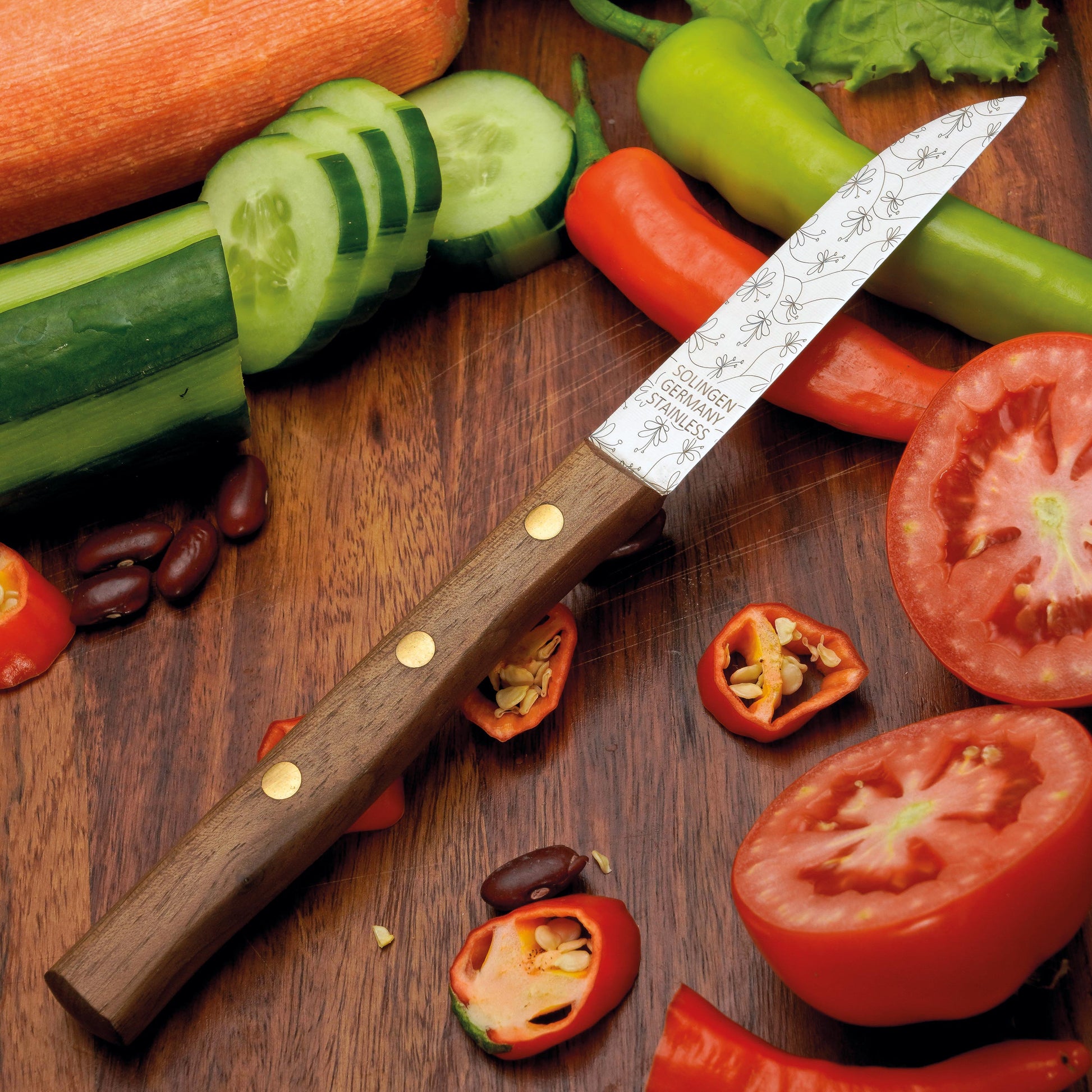 Frühstücksmesser Buckelsmesser aus Solingen mit Walnuss Holzgriff und Gravur Ranken – traditionelles Solingen Messer für Brot und Frühstück
